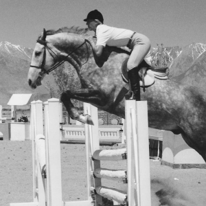 Corey on a horse jumping